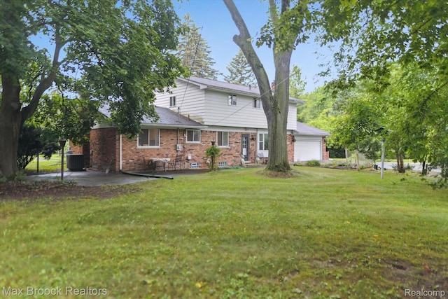 6810 Killarney Dr, Troy, MI 48098 - rear view of property with a lawn, brick siding, and an attached garage