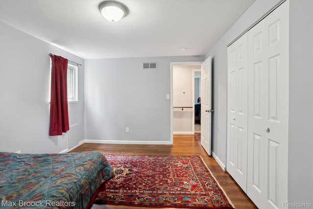 6810 Killarney Dr, Troy, MI 48098 - bedroom featuring dark wood finished floors and a closet