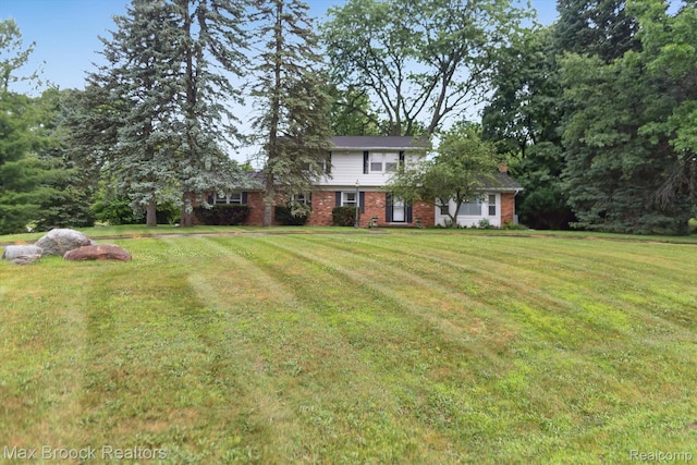 6810 Killarney Dr, Troy, MI 48098 - view of front of home with brick siding and a front yard