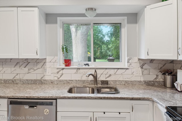 6810 Killarney Dr, Troy, MI 48098 - kitchen featuring stainless steel dishwasher, white cabinetry, backsplash, and light stone countertops