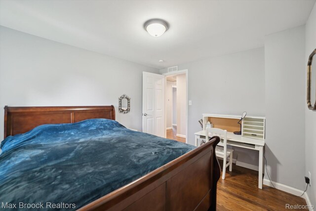 6810 Killarney Dr, Troy, MI 48098 - bedroom with dark wood-type flooring and baseboards