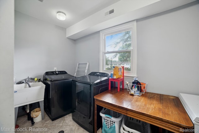 6810 Killarney Dr, Troy, MI 48098 - laundry room featuring independent washer and dryer and light tile patterned flooring