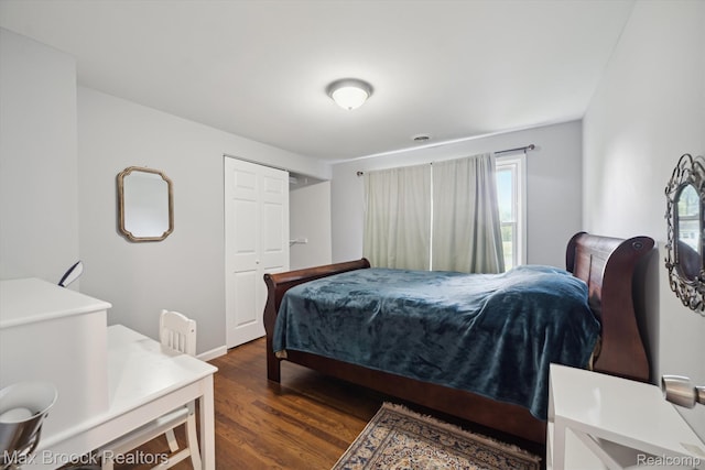 6810 Killarney Dr, Troy, MI 48098 - bedroom with dark wood-type flooring and a closet
