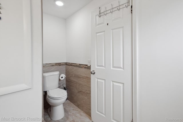 6810 Killarney Dr, Troy, MI 48098 - bathroom with tile walls, a wainscoted wall, and recessed lighting