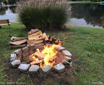 6810 Killarney Dr, Troy, MI 48098 - exterior view of an outdoor fire pit