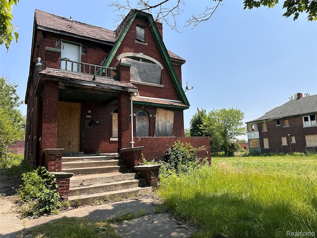 3962 Helen St, Detroit, MI 48207 - tudor house with a balcony and brick siding