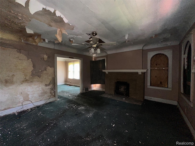 3962 Helen St, Detroit, MI 48207 - unfurnished living room featuring a fireplace and ceiling fan