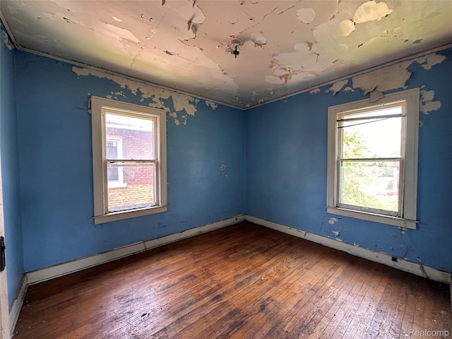 3962 Helen St, Detroit, MI 48207 - spare room featuring hardwood / wood-style flooring and plenty of natural light