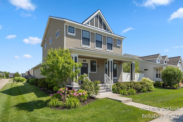 6725 Promenade St NE Unit 13, Rockford, MI 49341 - american foursquare style home with a front lawn and covered porch