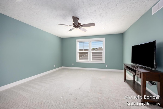 6725 Promenade St NE Unit 13, Rockford, MI 49341 - unfurnished living room featuring a ceiling fan, carpet flooring, and a textured ceiling