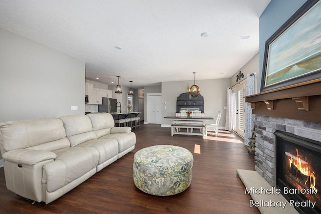 6725 Promenade St NE Unit 13, Rockford, MI 49341 - living room with dark wood-type flooring and a fireplace