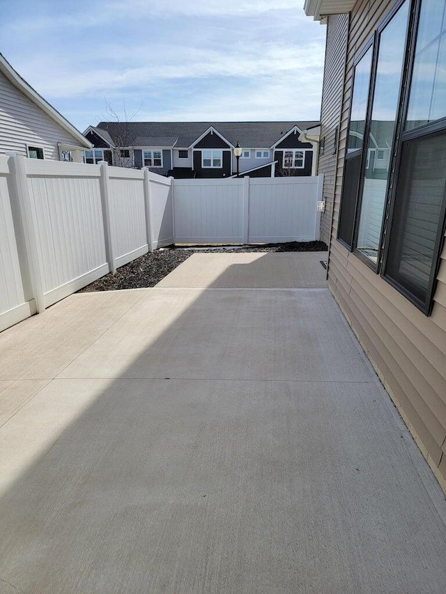 6725 Promenade St NE Unit 13, Rockford, MI 49341 - fenced backyard with a patio area