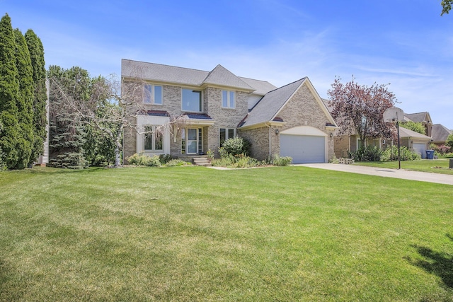 4213 Silverleaf Dr, Ypsilanti, MI 48197 - view of front facade featuring driveway, a front yard, a garage, and brick siding