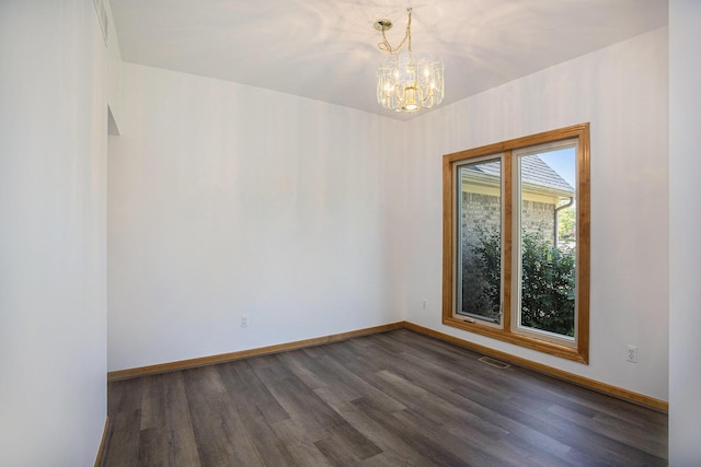 4213 Silverleaf Dr, Ypsilanti, MI 48197 - empty room featuring dark wood finished floors and a chandelier
