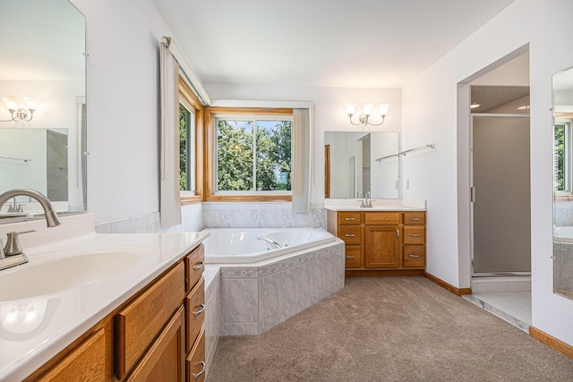 4213 Silverleaf Dr, Ypsilanti, MI 48197 - bathroom with healthy amount of natural light, a stall shower, two vanities, and a garden tub