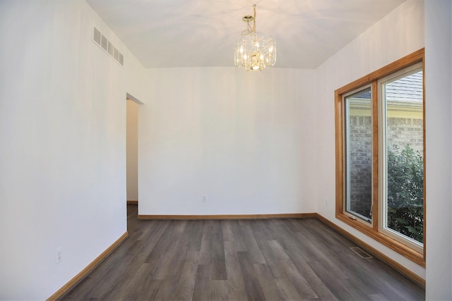 4213 Silverleaf Dr, Ypsilanti, MI 48197 - spare room featuring wood finished floors and a chandelier
