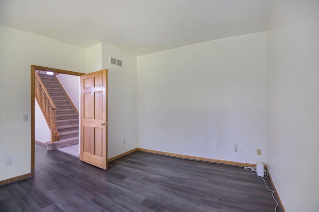 4213 Silverleaf Dr, Ypsilanti, MI 48197 - empty room featuring dark wood-style floors and stairway
