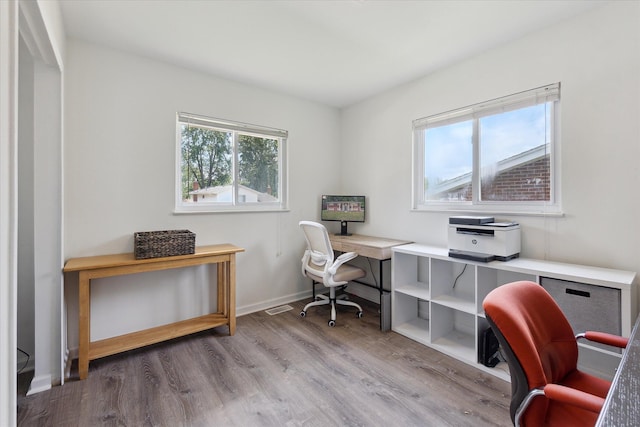 910 Newport Dr, Fenton, MI 48430 - home office with wood finished floors and baseboards