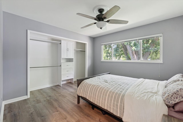 910 Newport Dr, Fenton, MI 48430 - bedroom featuring a closet, wood finished floors, and ceiling fan