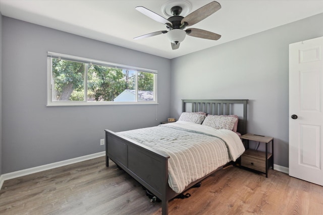 910 Newport Dr, Fenton, MI 48430 - bedroom featuring wood finished floors and ceiling fan