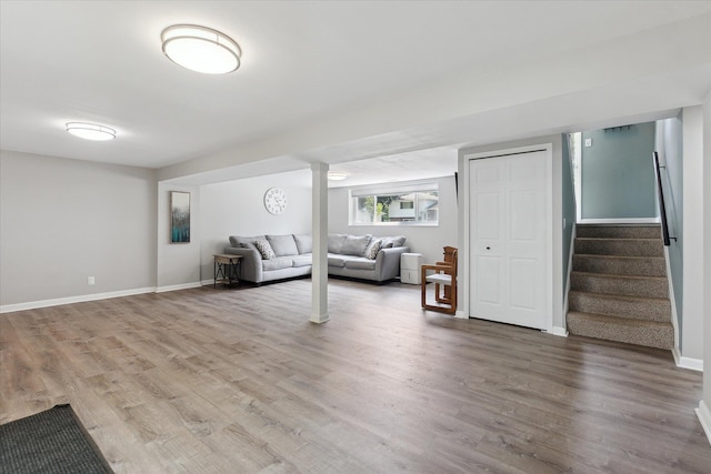 910 Newport Dr, Fenton, MI 48430 - living room with light wood-style flooring and stairs
