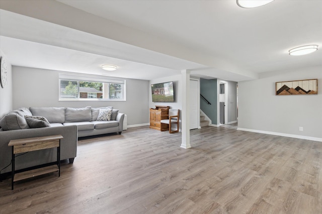 910 Newport Dr, Fenton, MI 48430 - living area with wood finished floors and stairs