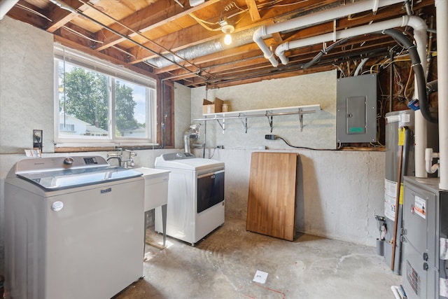 910 Newport Dr, Fenton, MI 48430 - laundry room featuring electric panel and separate washer and dryer