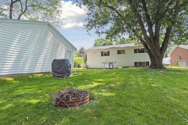 910 Newport Dr, Fenton, MI 48430 - view of yard featuring an outdoor fire pit