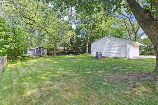 910 Newport Dr, Fenton, MI 48430 - view of yard featuring an outbuilding and view of scattered trees