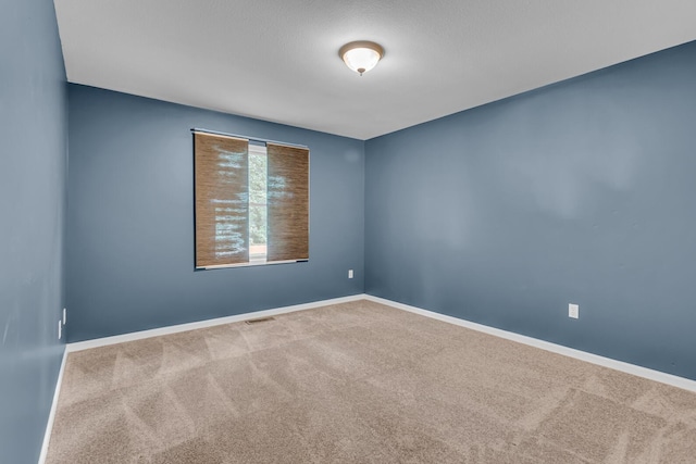 1615 Bunting Rd, Jackson, MI 49201 - empty room featuring carpet floors and baseboards