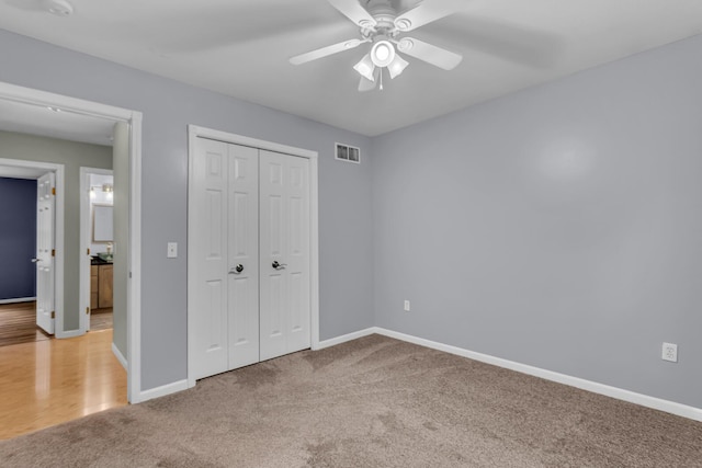 1615 Bunting Rd, Jackson, MI 49201 - unfurnished bedroom with carpet, a closet, and ceiling fan