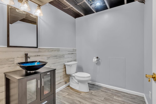 1615 Bunting Rd, Jackson, MI 49201 - bathroom featuring vanity and wood finished floors