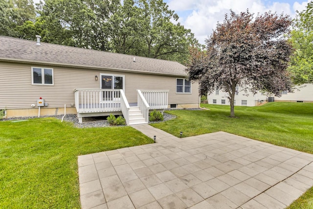 1615 Bunting Rd, Jackson, MI 49201 - back of property with a patio area, a yard, and a deck