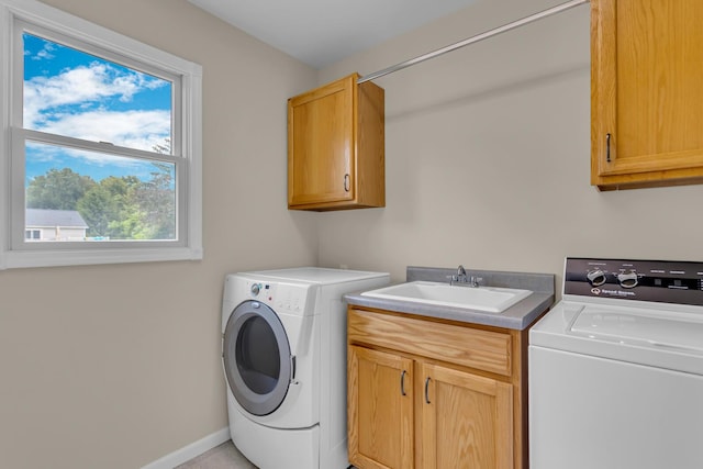 1615 Bunting Rd, Jackson, MI 49201 - laundry area featuring cabinet space and separate washer and dryer