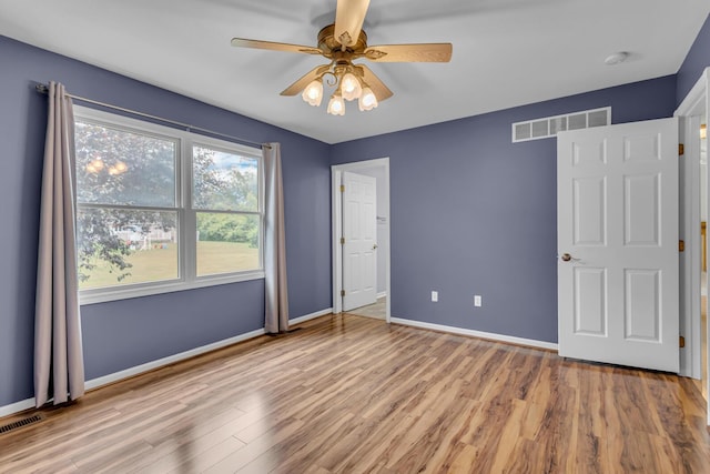 1615 Bunting Rd, Jackson, MI 49201 - unfurnished bedroom featuring wood finished floors and ceiling fan