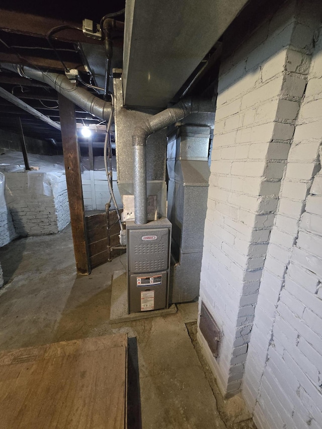 947 Pearl St, Benton Harbor, MI 49022 - utility room featuring heating unit