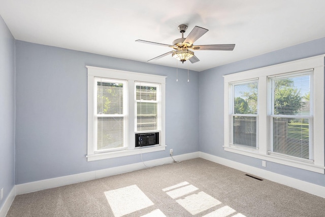947 Pearl St, Benton Harbor, MI 49022 - empty room featuring light carpet, healthy amount of natural light, and a ceiling fan