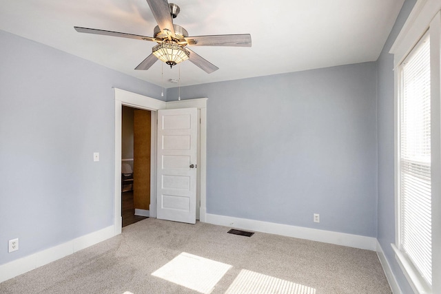 947 Pearl St, Benton Harbor, MI 49022 - empty room with carpet floors and a ceiling fan