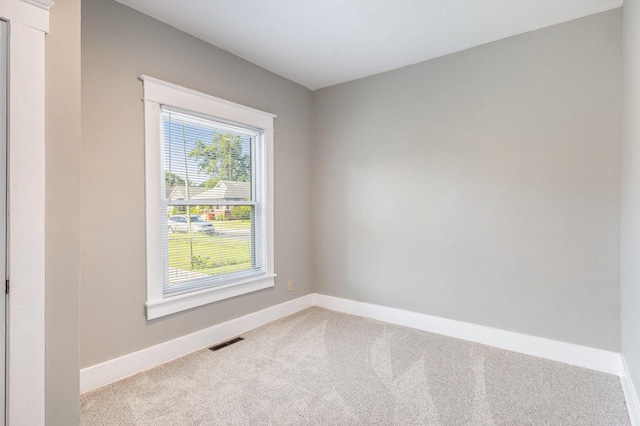 947 Pearl St, Benton Harbor, MI 49022 - empty room with carpet flooring and baseboards