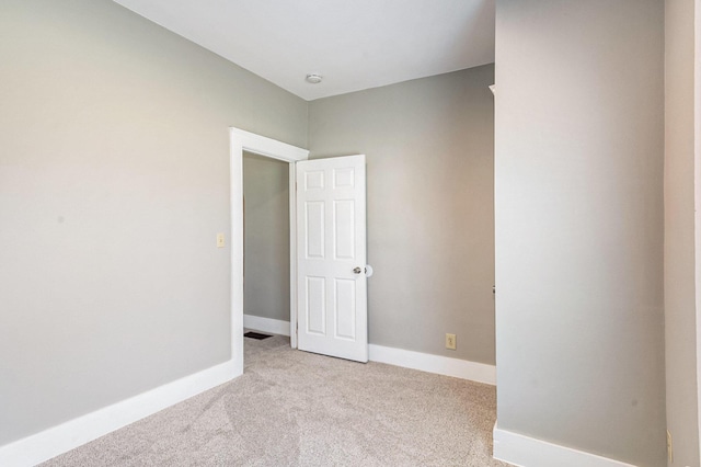 947 Pearl St, Benton Harbor, MI 49022 - spare room with light colored carpet and baseboards