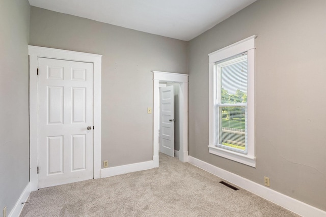 947 Pearl St, Benton Harbor, MI 49022 - unfurnished bedroom with carpet floors and baseboards