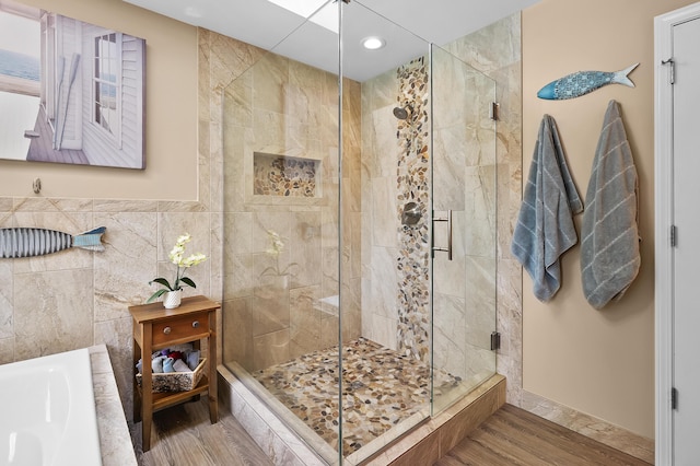 6794 Brickleton Ct, Portage, MI 49024 - full bath featuring a shower stall, a garden tub, recessed lighting, tile walls, and wood finished floors