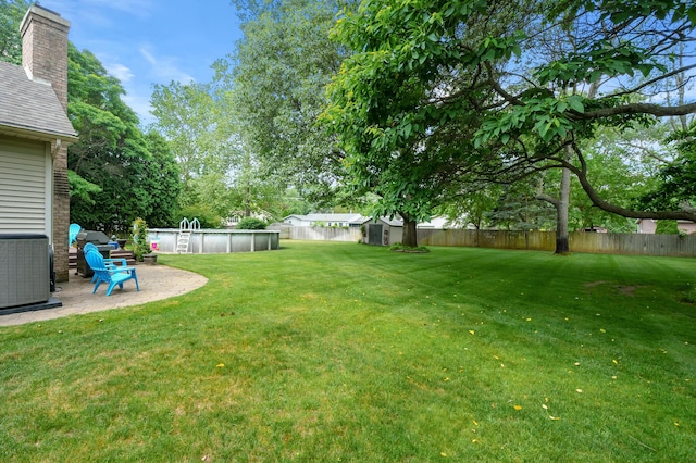 6794 Brickleton Ct, Portage, MI 49024 - fenced backyard with a shed and an outdoor pool