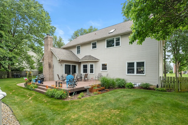 6794 Brickleton Ct, Portage, MI 49024 - back of property featuring a fenced backyard, a wooden deck, a chimney, and roof with shingles