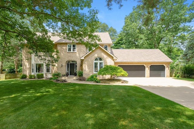 6794 Brickleton Ct, Portage, MI 49024 - view of front of house with driveway, a garage, brick siding, and roof with shingles