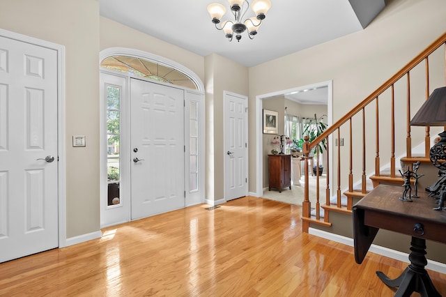 6794 Brickleton Ct, Portage, MI 49024 - foyer featuring a chandelier, healthy amount of natural light, and light wood-type flooring