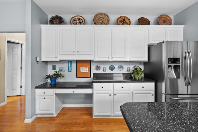 6794 Brickleton Ct, Portage, MI 49024 - kitchen with stainless steel fridge with ice dispenser, light wood-style floors, white cabinets, and dark stone counters
