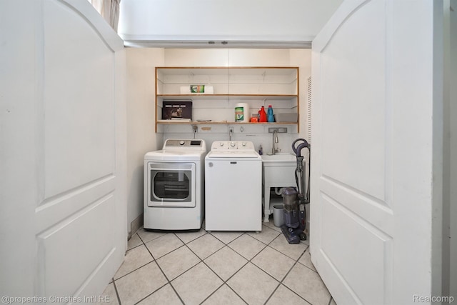30160 Marshall St, Southfield, MI 48076 - laundry area featuring independent washer and dryer and light tile patterned floors