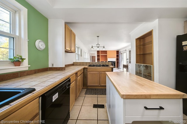 30160 Marshall St, Southfield, MI 48076 - kitchen with black appliances, a chandelier, wood counters, and plenty of natural light
