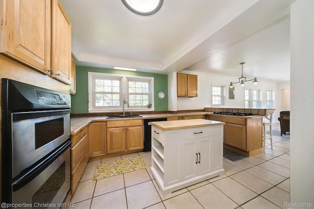 30160 Marshall St, Southfield, MI 48076 - kitchen featuring double oven, black dishwasher, a peninsula, gas cooktop, and plenty of natural light